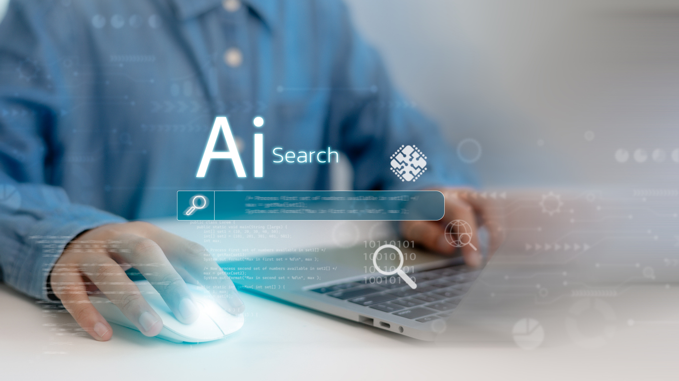 guy doing ai search on laptop