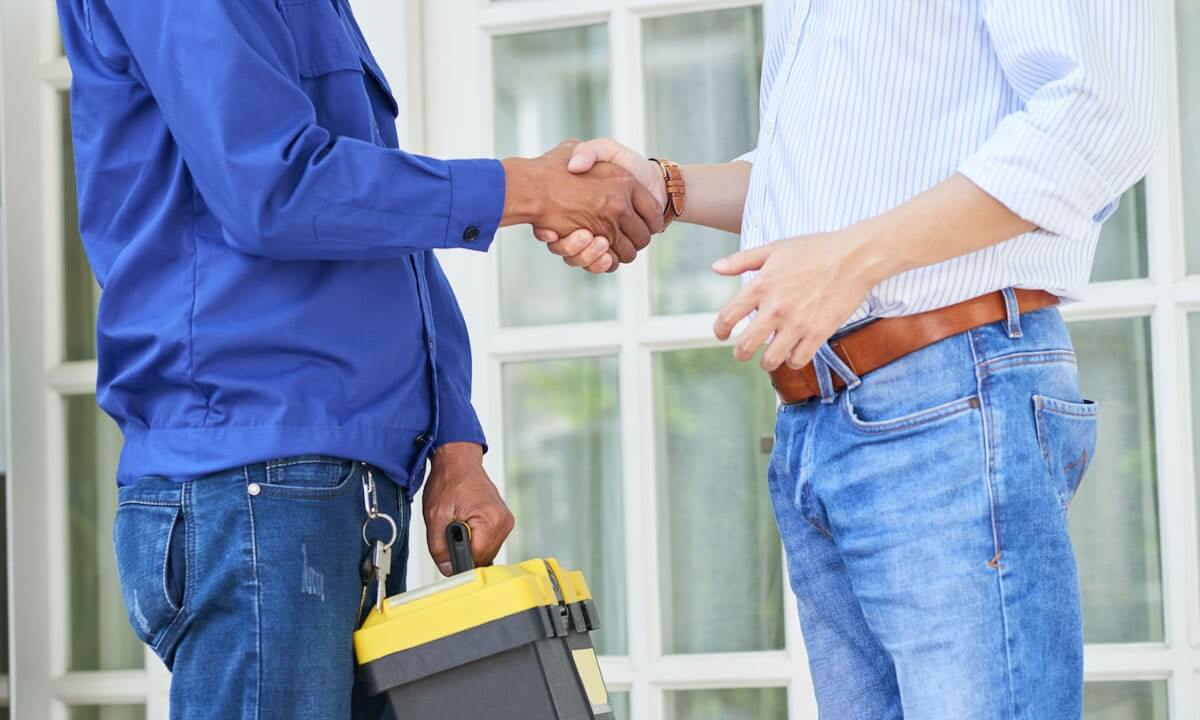 field service crew shaking hands with customer