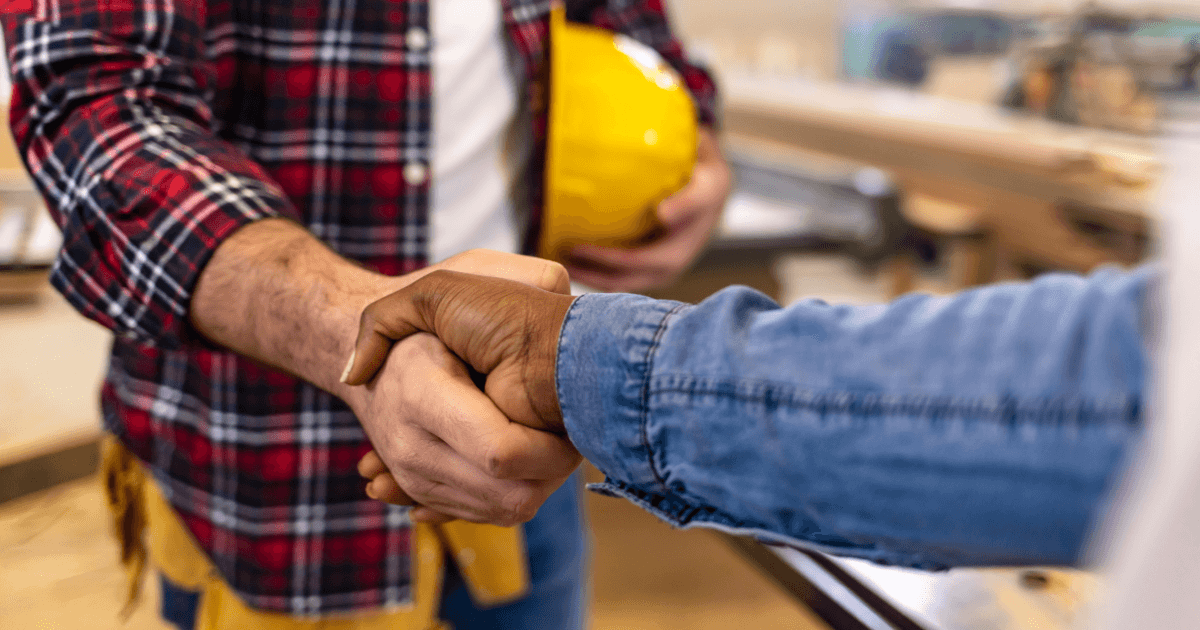 local handyman shaking customer hands